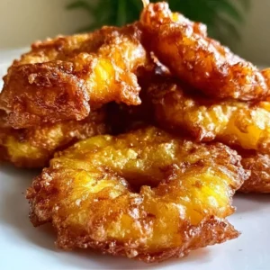 Deliciously golden pineapple fritters served on a plate