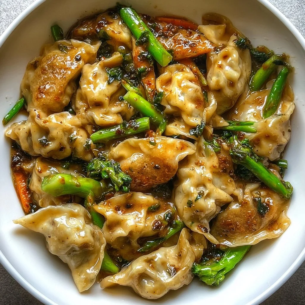 A vibrant potsticker stir fry with vegetables and sauces in a colorful dish.