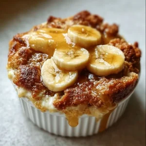 Delicious homemade banana cobbler served with a scoop of vanilla ice cream