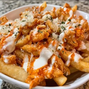 Buffalo Chicken Fries topped with ranch dressing and green onions