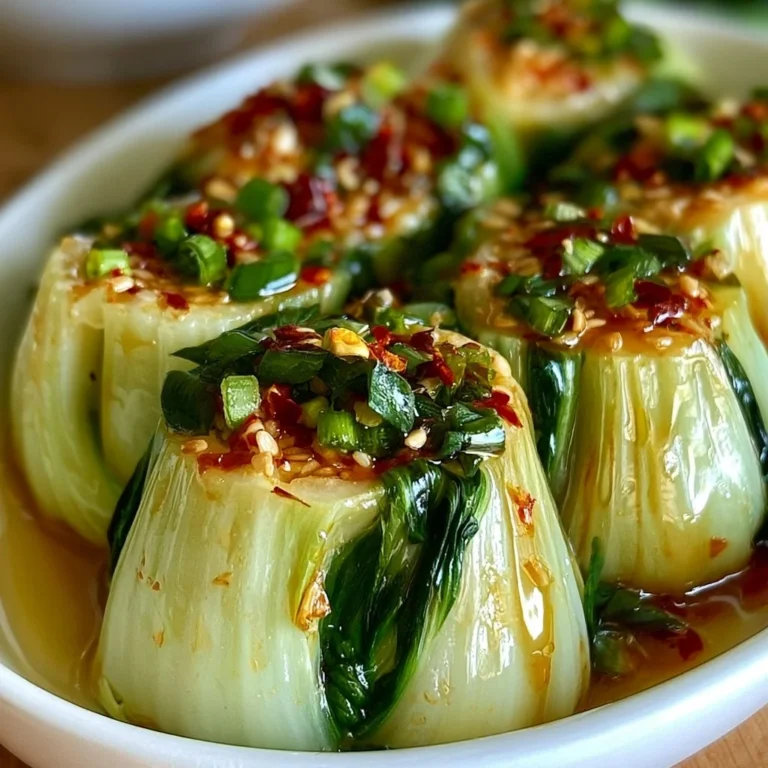 Bok Choy with Ginger Chili Sauce served in a bowl, garnished with chili flakes